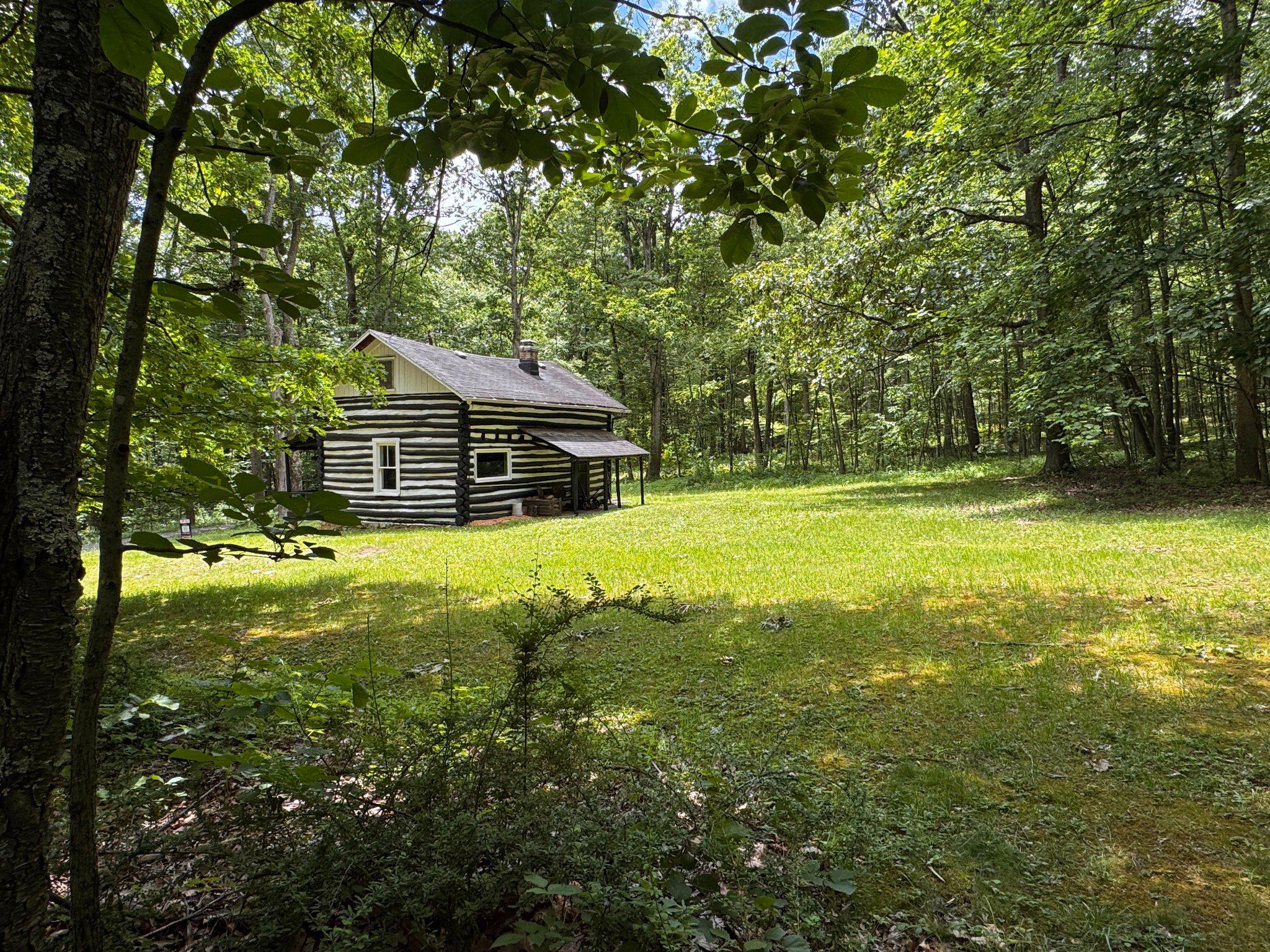 4464 Tram Road Spruce Creek, PA 16683 - Photo 44 of 53 a house view with swimming pool in front of it