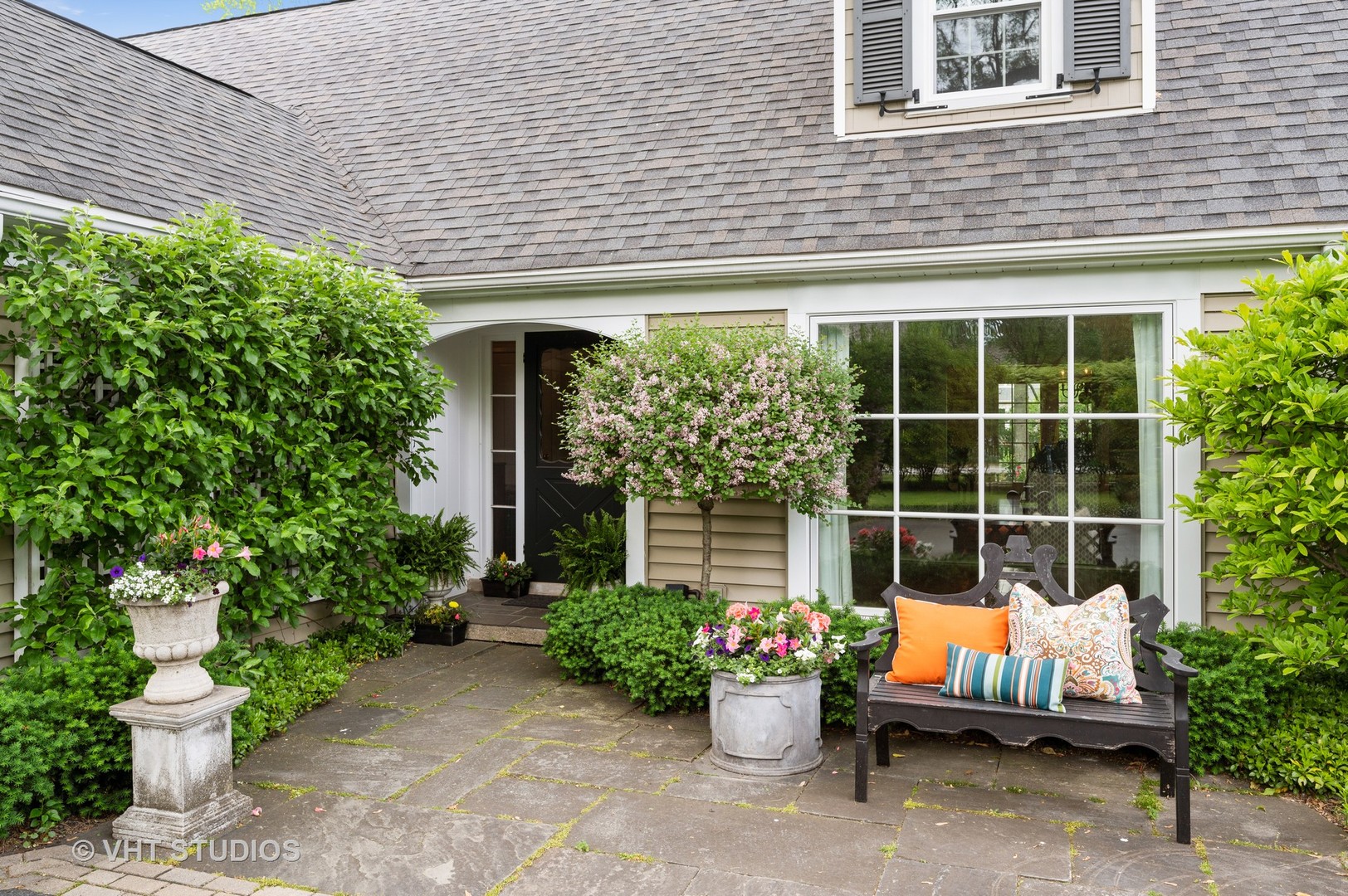 1175 Hill Road Winnetka, IL 60093 - Photo 2 of 37 a view of a patio with couches chairs and potted plants