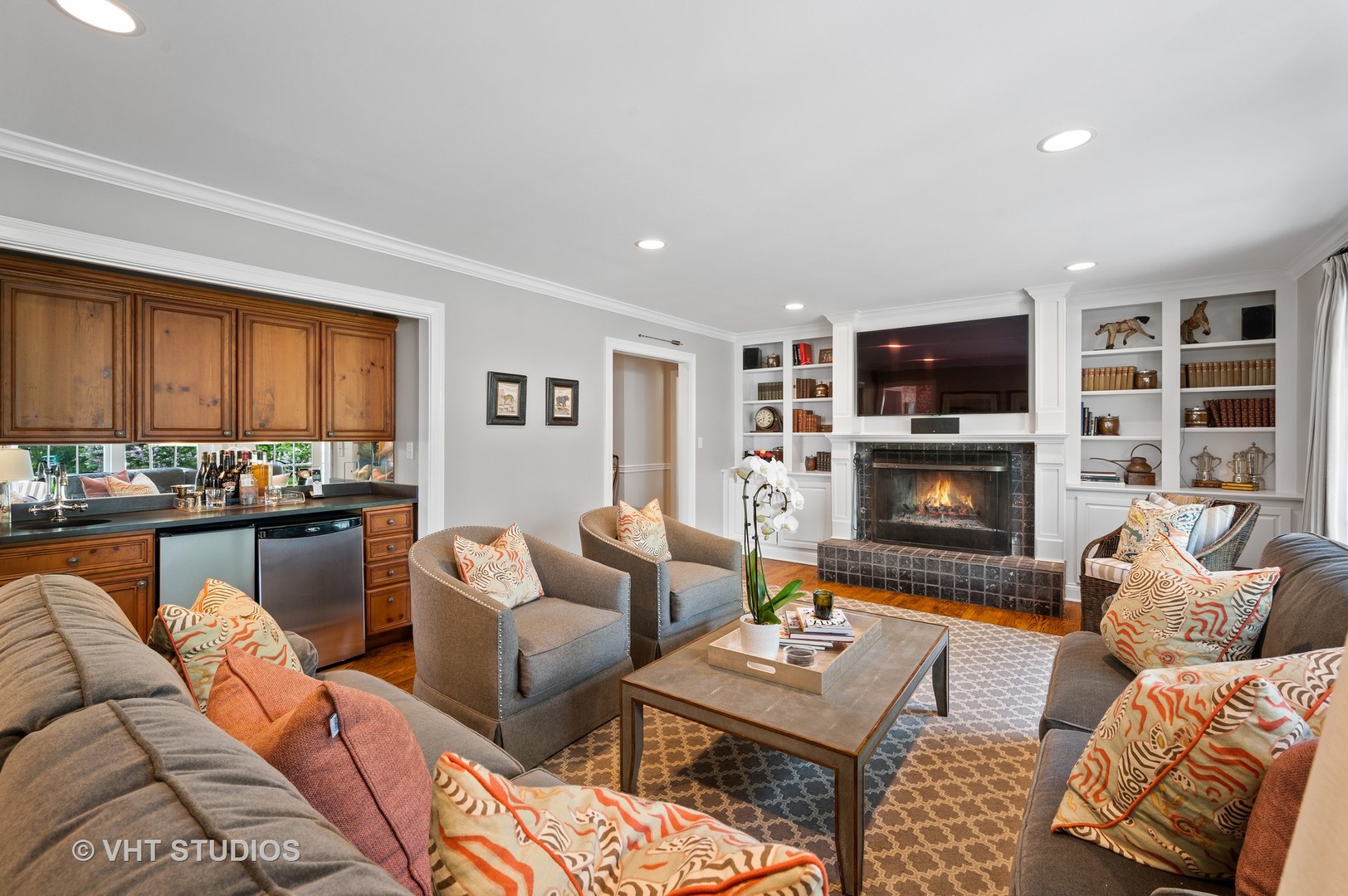 1175 Hill Road Winnetka, IL 60093 - Photo 14 of 37 a living room with furniture fireplace and flat screen tv