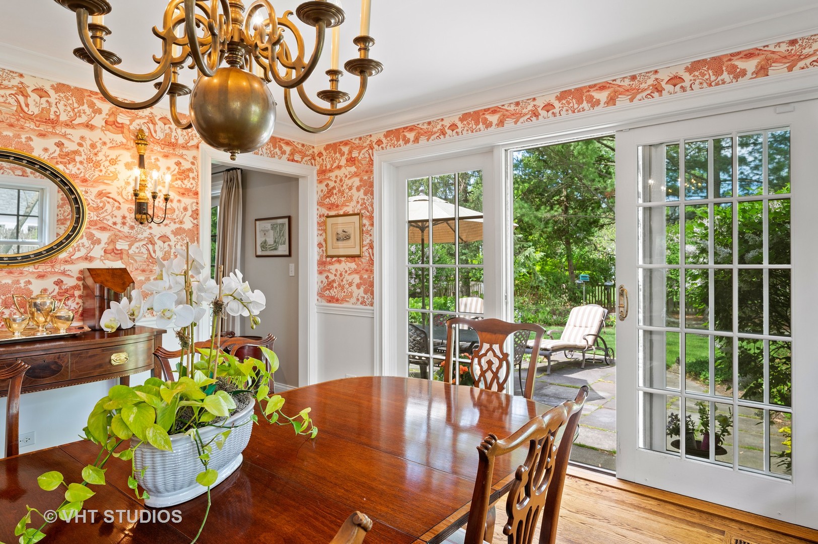 1175 Hill Road Winnetka, IL 60093 - Photo 18 of 37 a dining room with furniture a large window and potted plants