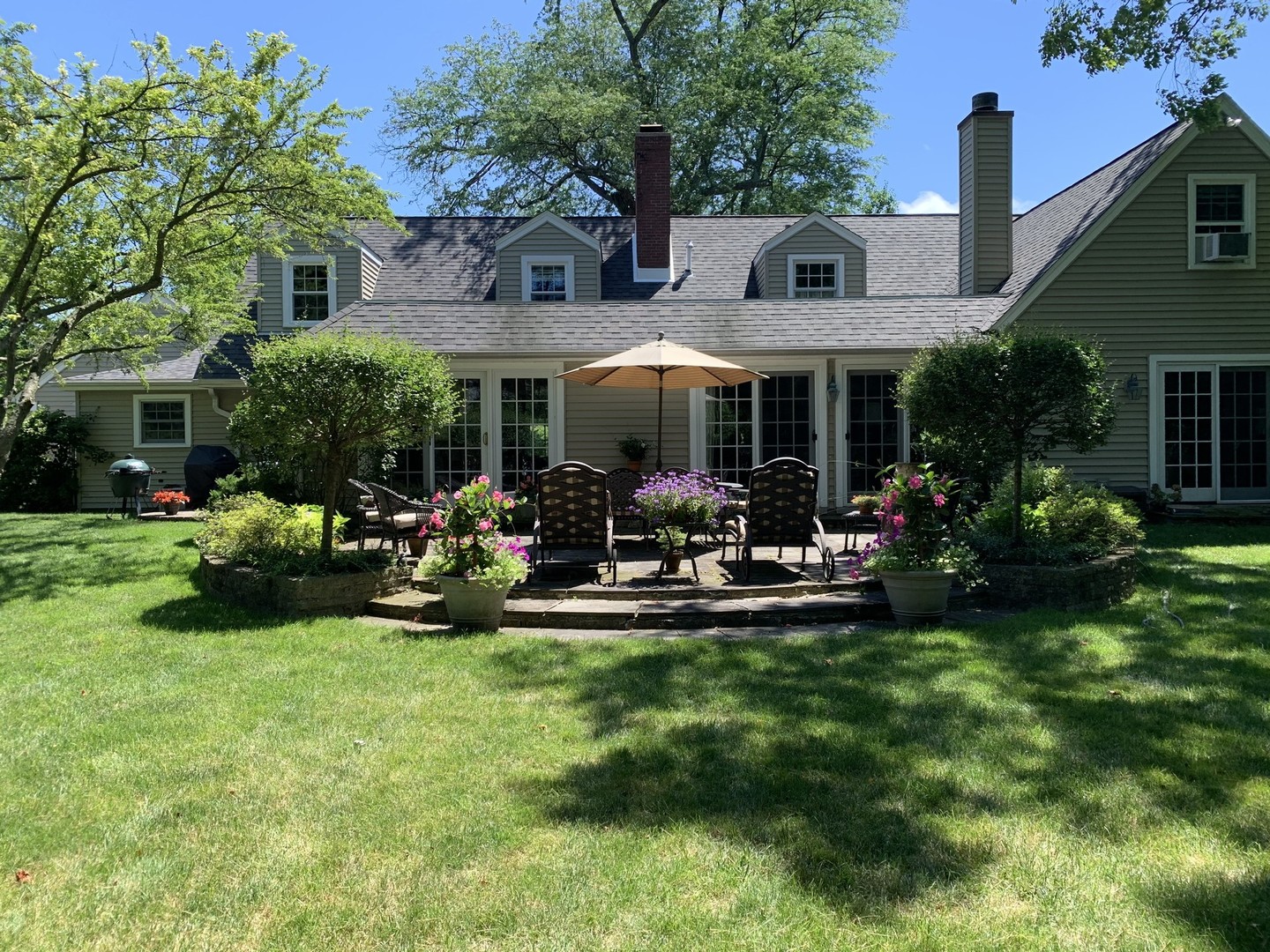 1175 Hill Road Winnetka, IL 60093 - Photo 35 of 37 a view of a house with backyard porch and sitting area