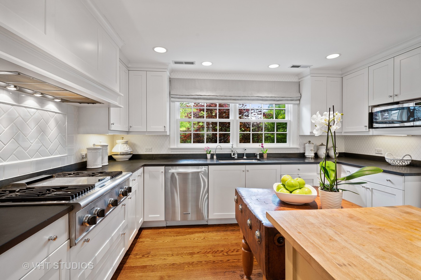 1175 Hill Road Winnetka, IL 60093 - Photo 5 of 37 a kitchen with a stove a sink and a counter top space
