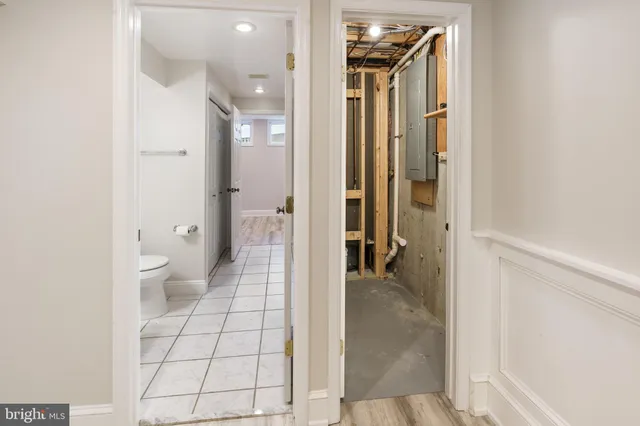 a bathroom with a glass door shower