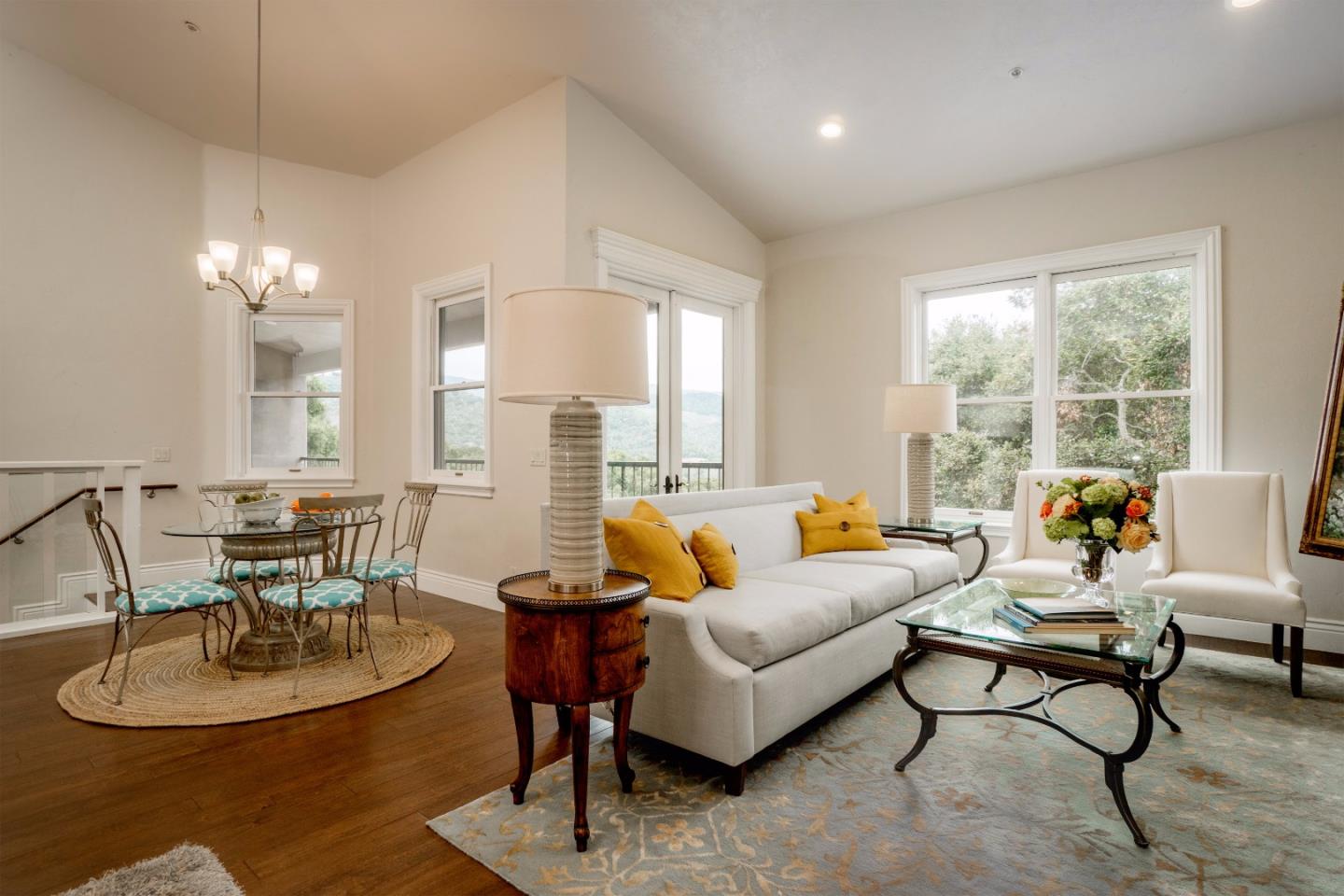 9945 Eddy Road Carmel, CA 93923 - Photo 14 of 31 a living room with furniture and a chandelier