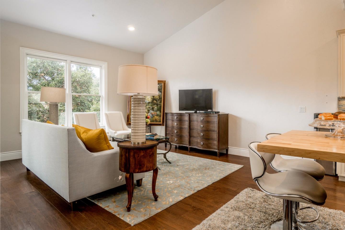9945 Eddy Road Carmel, CA 93923 - Photo 15 of 31 a living room with furniture and a flat screen tv
