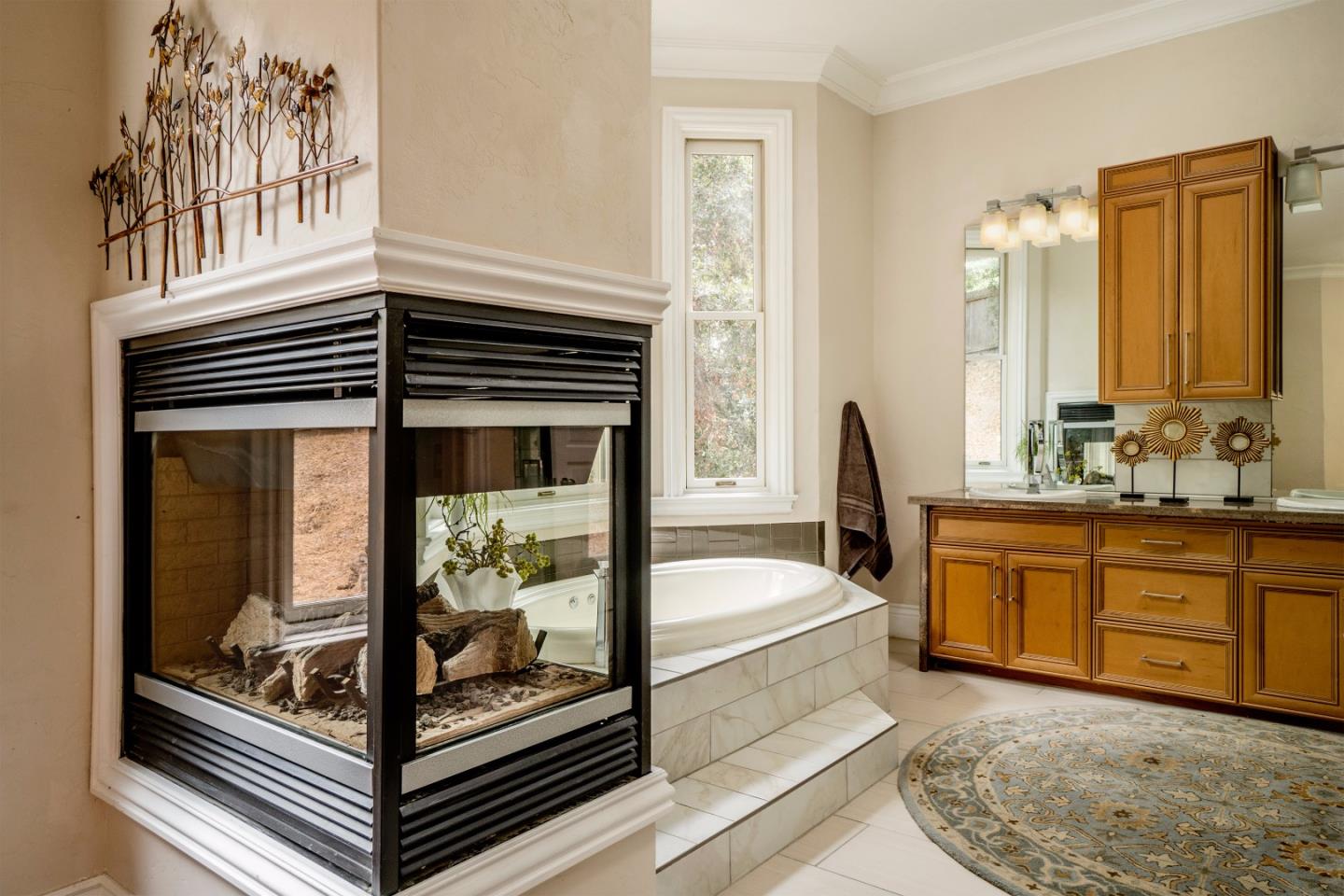 9945 Eddy Road Carmel, CA 93923 - Photo 18 of 31 a bathroom with a tub sink and mirror