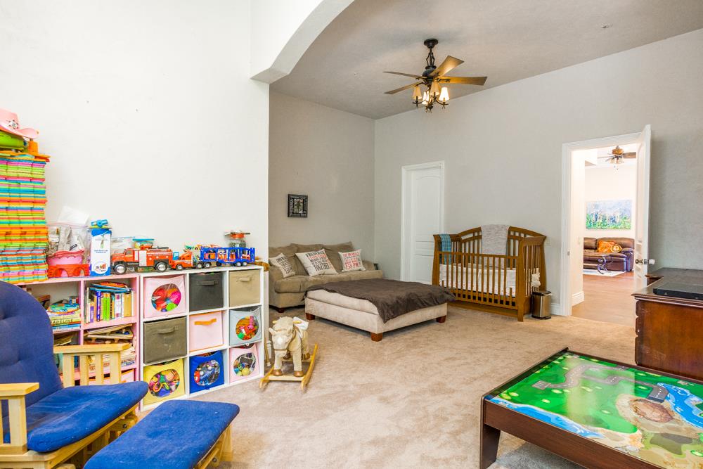 9945 Eddy Road Carmel, CA 93923 - Photo 23 of 31 a living room with furniture and a book shelf