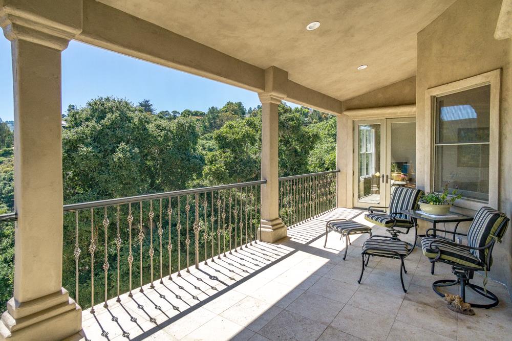 9945 Eddy Road Carmel, CA 93923 - Photo 25 of 31 a balcony with wooden floor and outdoor seating
