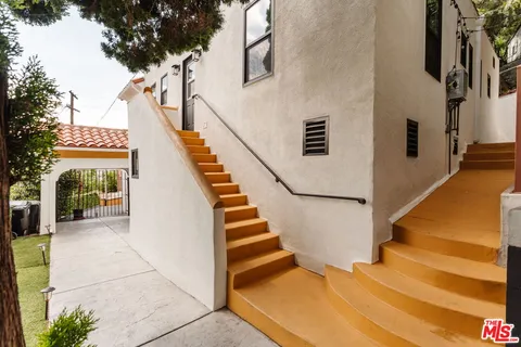 a room with furniture and a potted plant