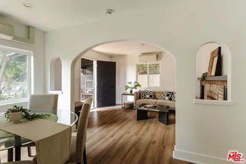 a bedroom with a bed and a mirror