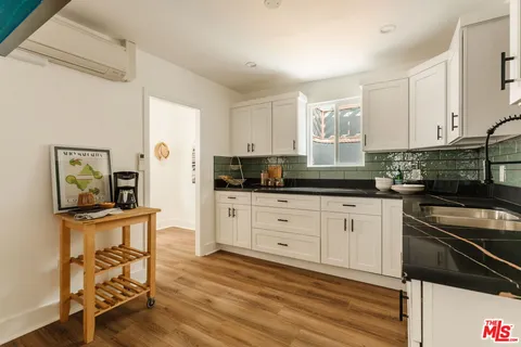 a bathroom with a sink and mirror