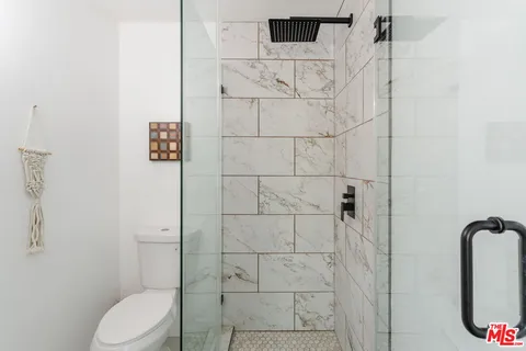 a view of a chairs and table in patio