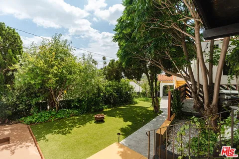 a view of a backyard with street