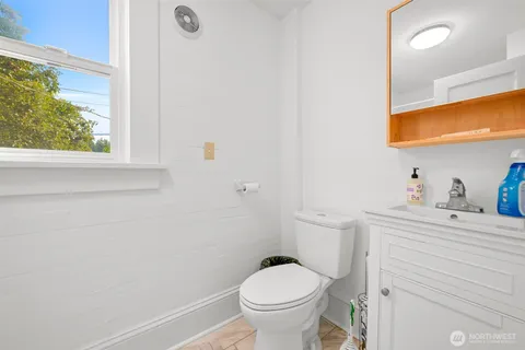 a room with table chairs and windows