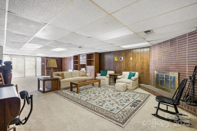 a living room with furniture rug and window