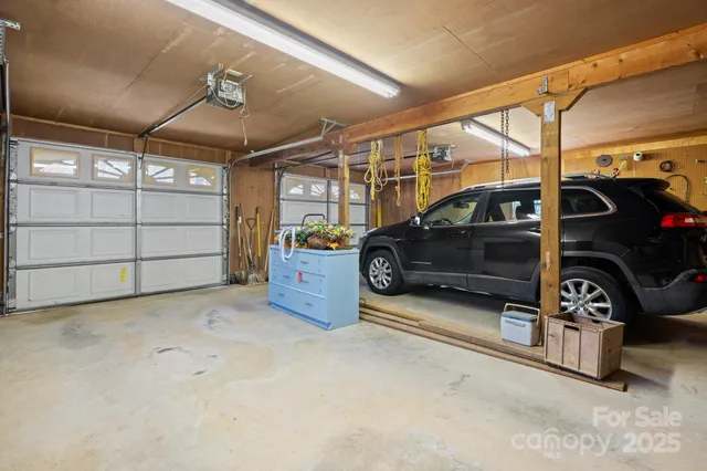 a view of garage with cars