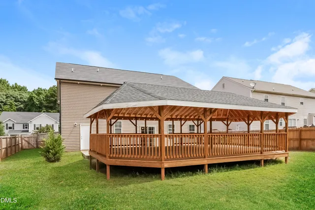 a view of a garden with a deck