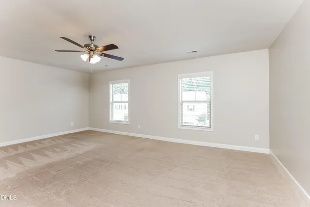 a view of empty room with windows