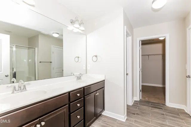 a bathroom with a granite countertop sink mirror and double