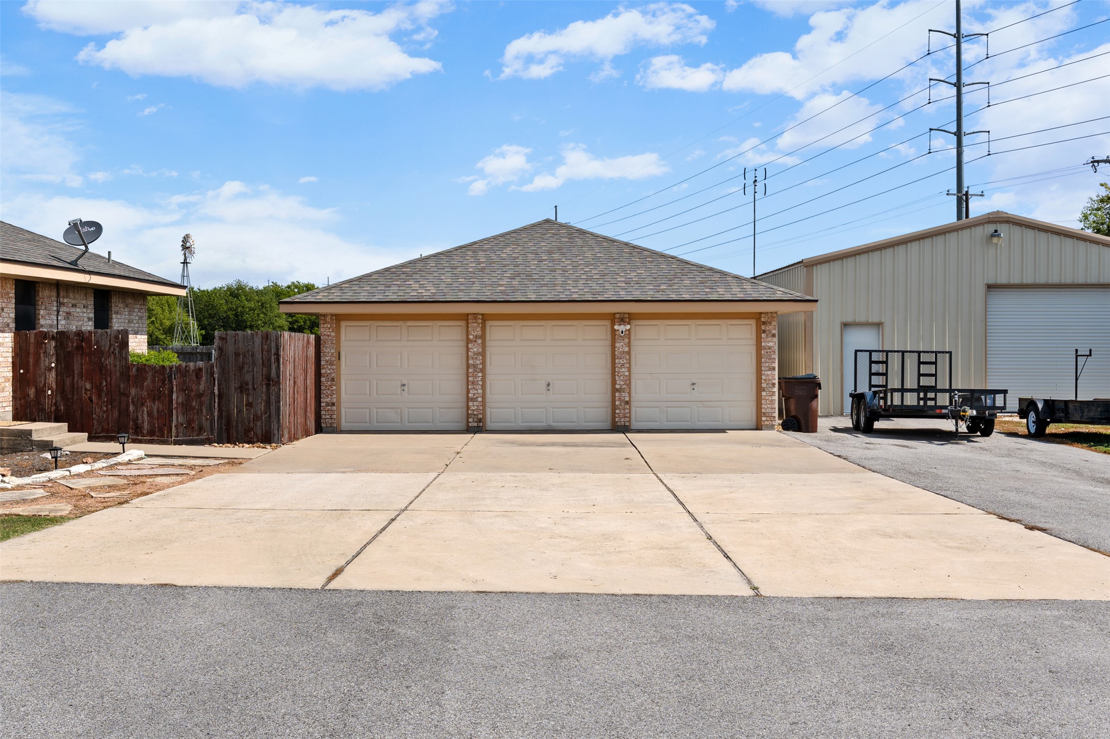 1512 Panther Loop Pflugerville, TX 78660 - Photo 4 of 40 A spacious three-car garage and extensive driveway offer ample parking and storage.