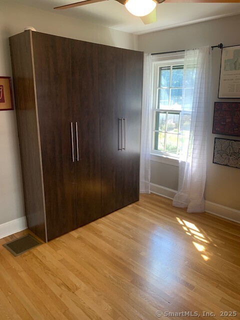 345 Courtland Avenue Bridgeport, CT 06605 - Photo 13 of 38 a bedroom with a bed and a window