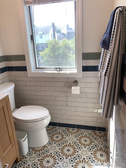 345 Courtland Avenue Bridgeport, CT 06605 - Photo 20 of 38 a bathroom with a toilet and a shower