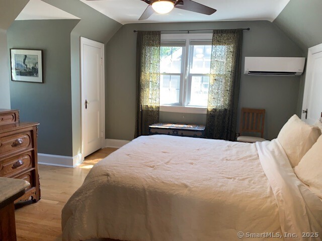 345 Courtland Avenue Bridgeport, CT 06605 - Photo 21 of 38 a bedroom with a bed and a window