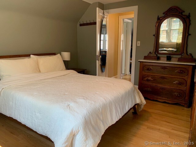 345 Courtland Avenue Bridgeport, CT 06605 - Photo 23 of 38 a bedroom with a bed and a dresser