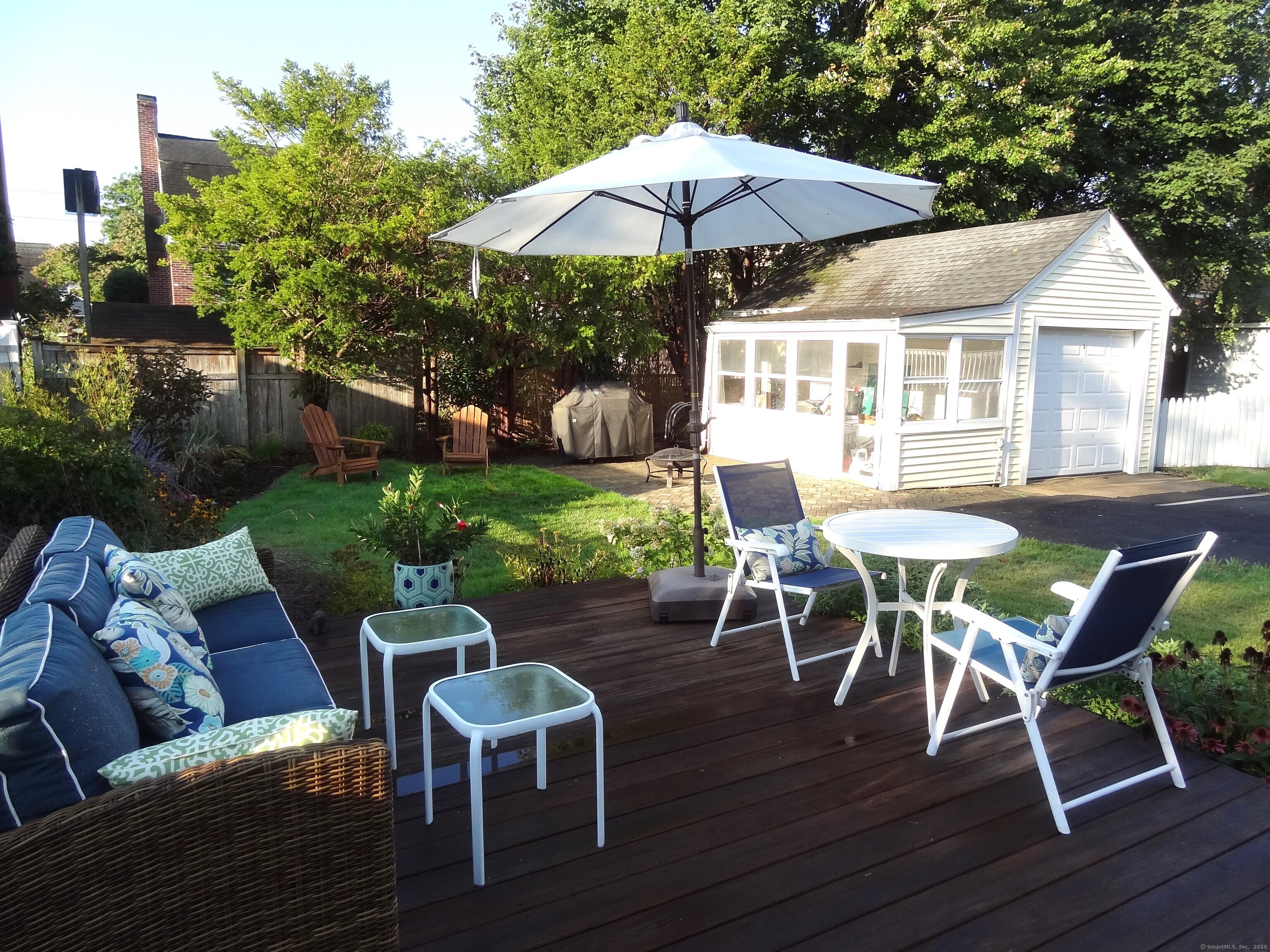 345 Courtland Avenue Bridgeport, CT 06605 - Photo 29 of 38 a patio with wooden floor table and chairs