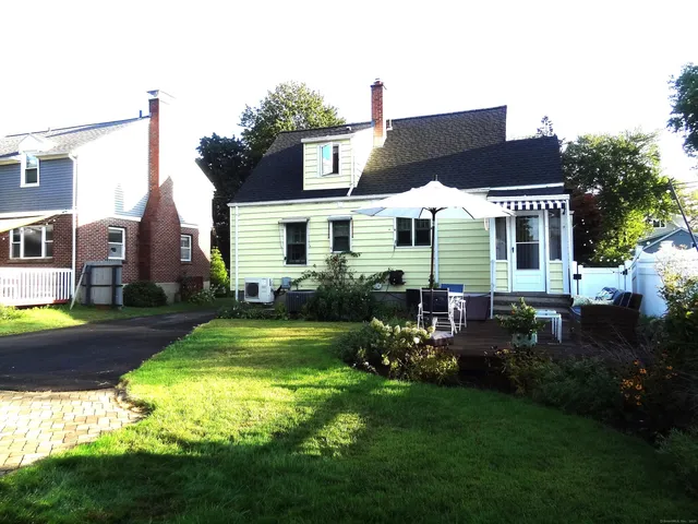a view of a house with a back yard
