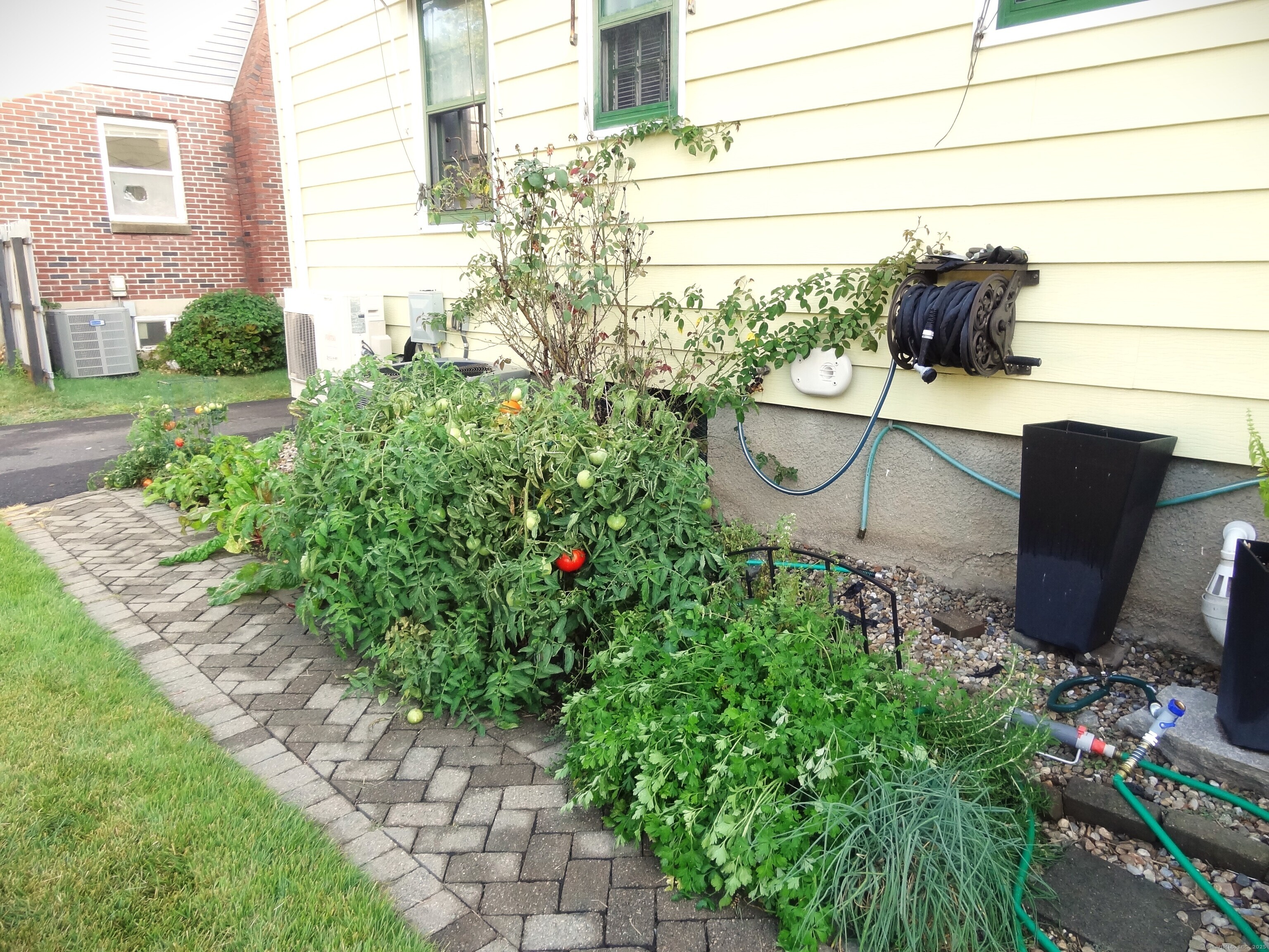 345 Courtland Avenue Bridgeport, CT 06605 - Photo 35 of 38 a view of a chair and table in the backyard