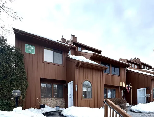 a front view of a house with barbeque grill