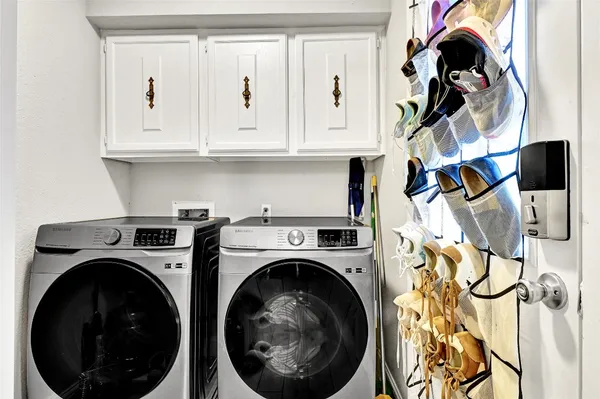 a utility room with dryer and washer