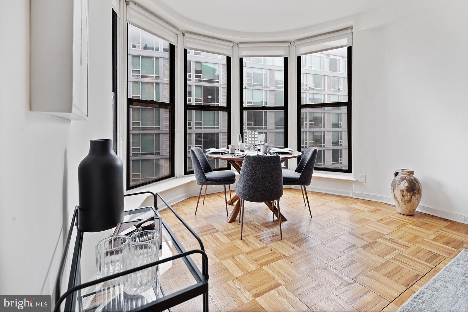 2201 Pennsylvania Avenue, Unit 1112 Philadelphia, PA 19130 - Photo 6 of 45 a dining room with furniture and window