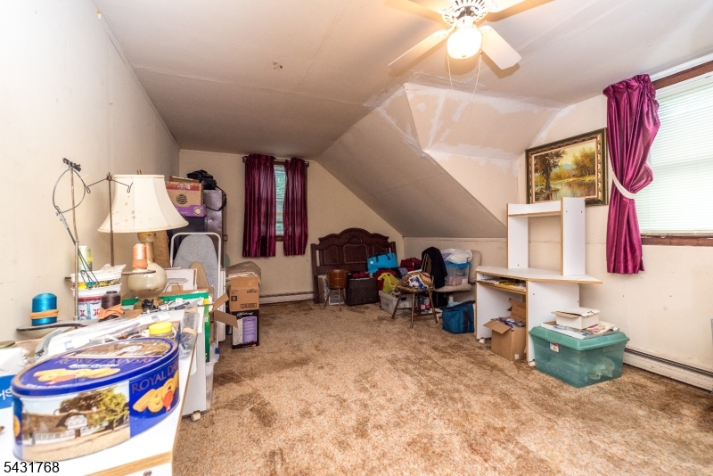 400 Mechlin Corner Road Pittstown, NJ 08867 - Photo 22 of 29 a bedroom with furniture and a lamp