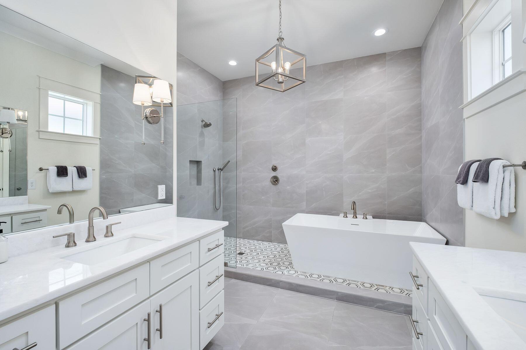 1979 Baytowne Loop Miramar Beach, FL 32550 - Photo 19 of 35 a bathroom with a sink double vanity granite tub and a mirror