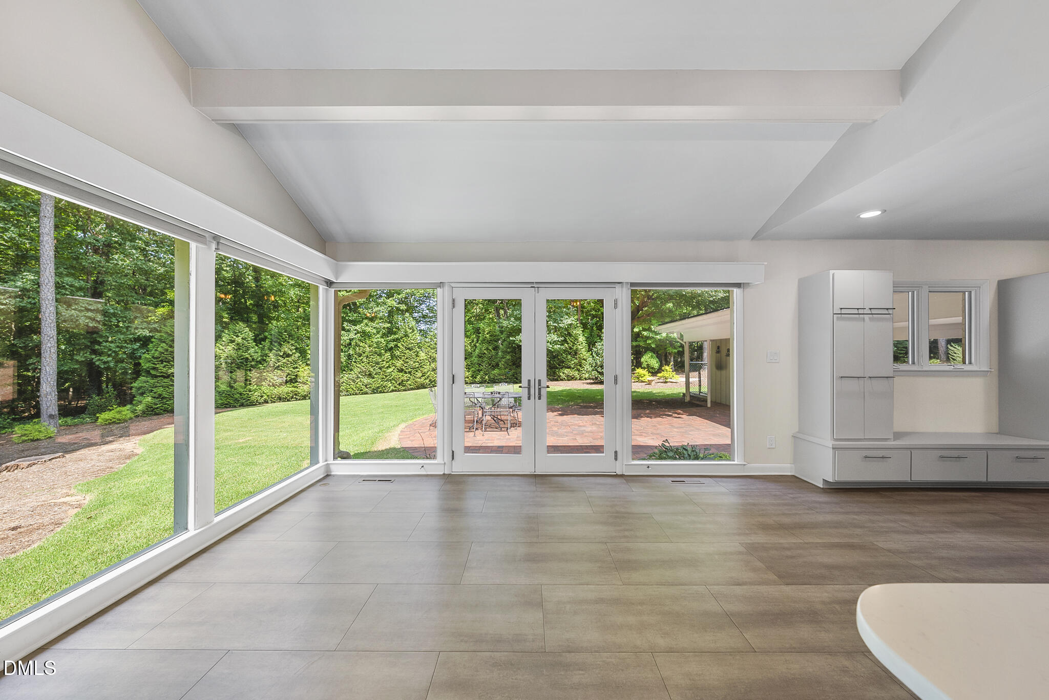 1605 Ridge Road Raleigh, NC 27607 - Photo 17 of 34 a view of empty room with wooden floor and floor to ceiling window