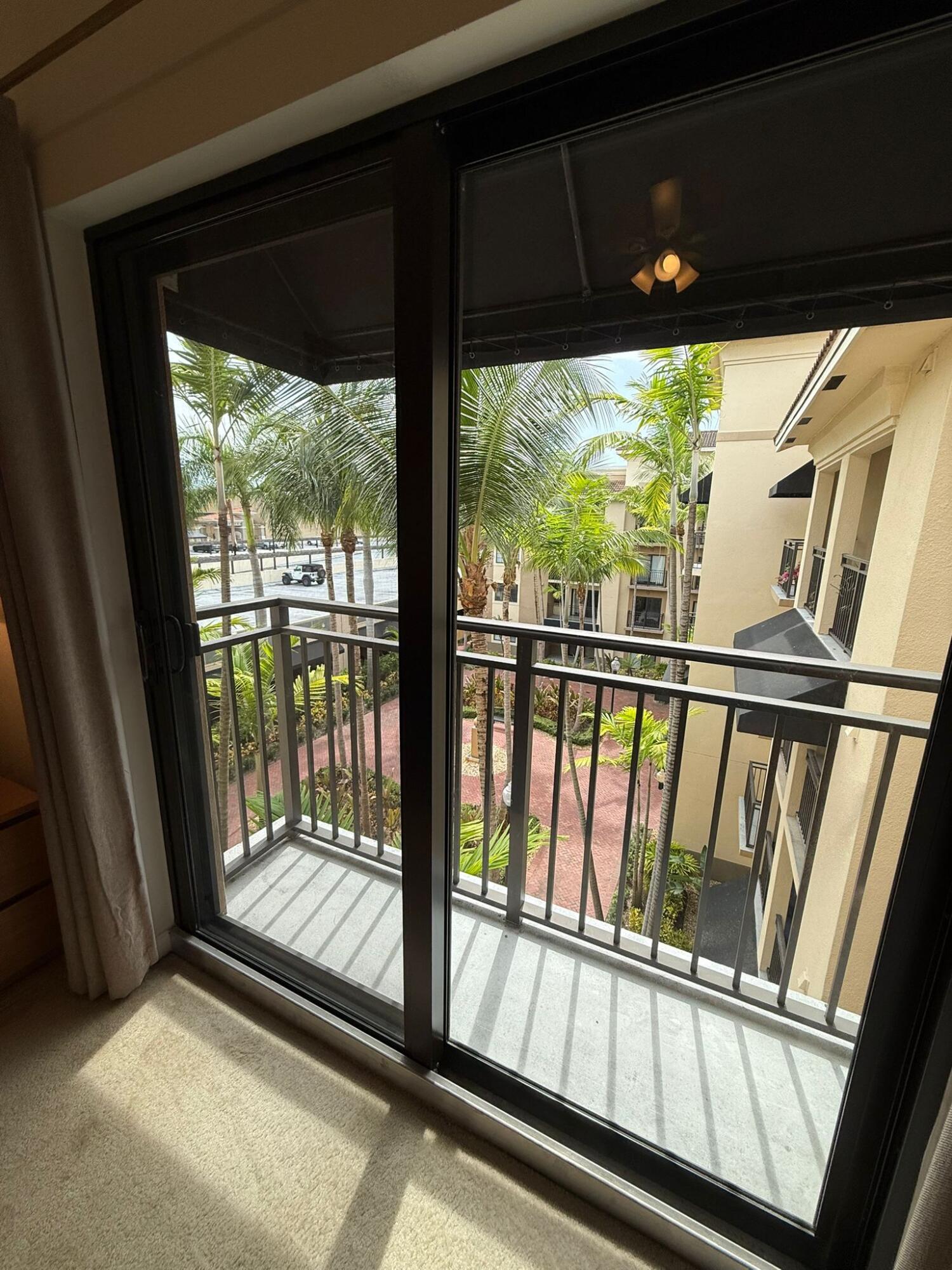 4905 Midtown Lane, Unit 2405 Palm Beach Gardens, FL 33418 - Photo 11 of 28 a view of a porch