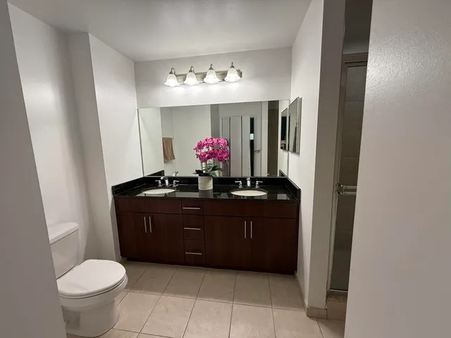 a bathroom with a sink vanity and a mirror