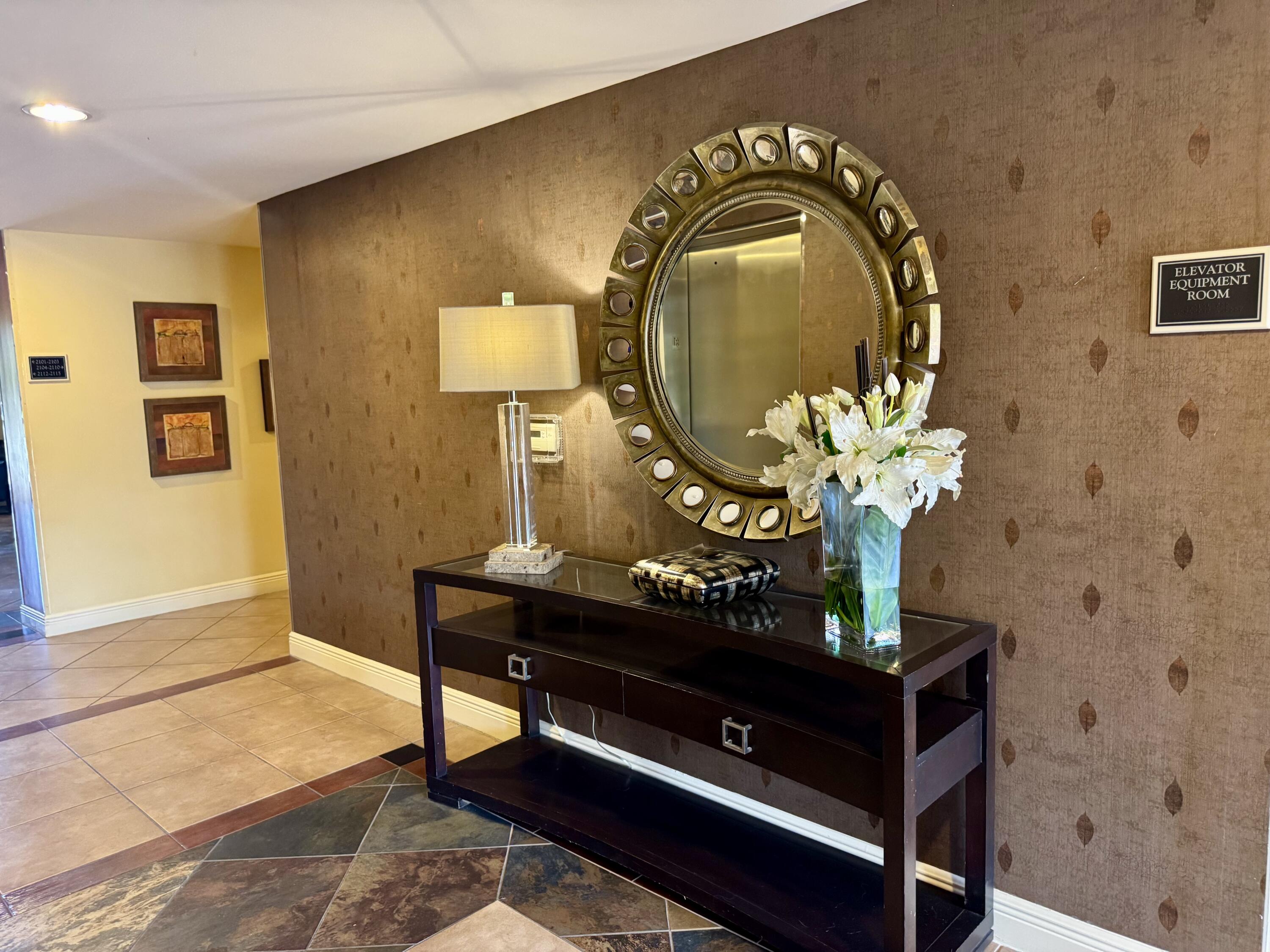 4905 Midtown Lane, Unit 2405 Palm Beach Gardens, FL 33418 - Photo 19 of 28 a living room with furniture