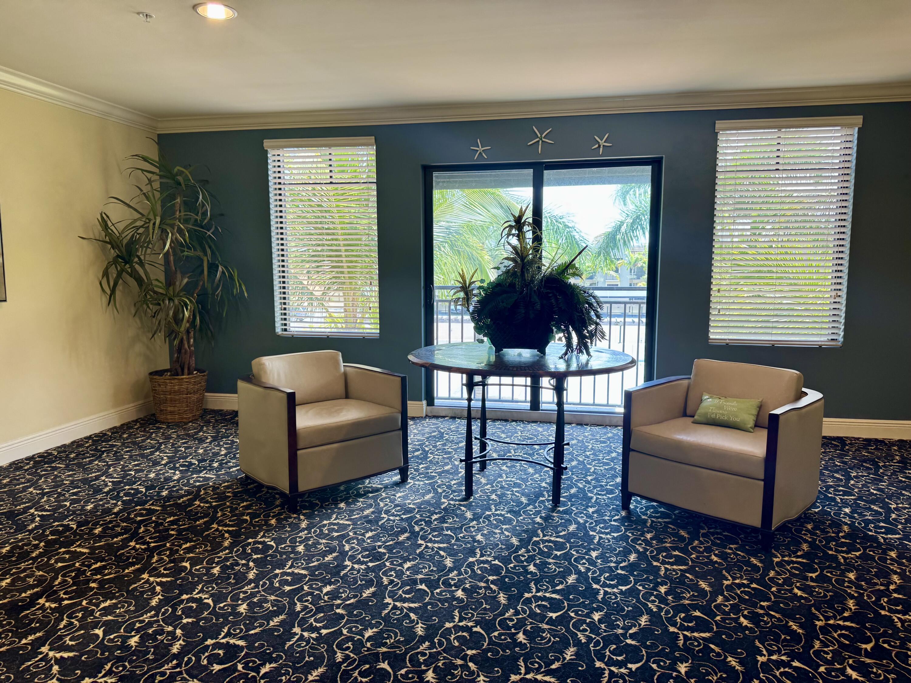 4905 Midtown Lane, Unit 2405 Palm Beach Gardens, FL 33418 - Photo 20 of 28 a living room with furniture and a large window
