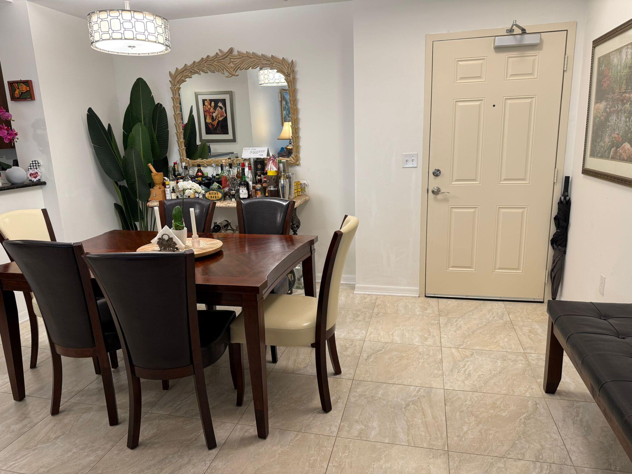 4905 Midtown Lane, Unit 2405 Palm Beach Gardens, FL 33418 - Photo 3 of 28 a view of a dining room with furniture