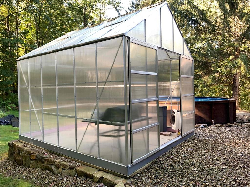 583 Kiester Road Slippery Rock, PA 16057 - Photo 33 of 34 Heated Greenhouse with cement flooring and gas heat.