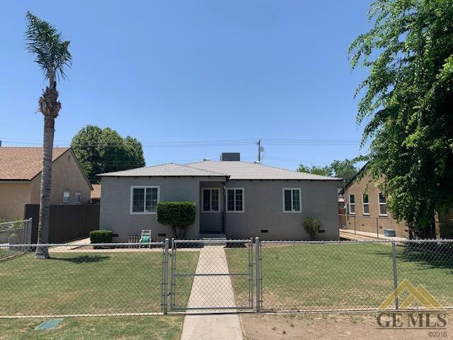 a view of a house with backyard porch and sitting area