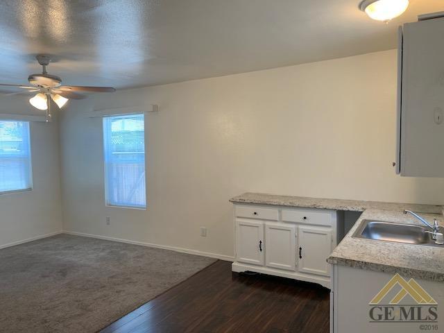 Undisclosed Address Bakersfield, CA 93304 - Photo 17 of 32 a view of cabinets and utility room