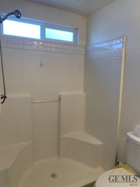 Undisclosed Address Bakersfield, CA 93304 - Photo 25 of 32 a bathroom with a shower and a toilet