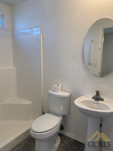 Undisclosed Address Bakersfield, CA 93304 - Photo 26 of 32 a bathroom with a sink toilet and shower