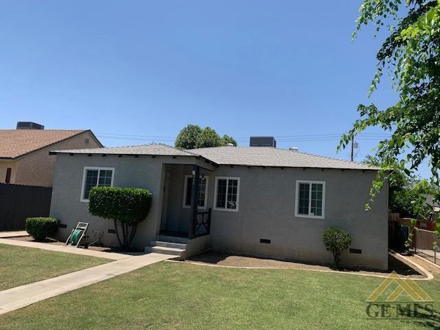 Undisclosed Address Bakersfield, CA 93304 - Photo 3 of 32 a front view of a house with potted plants