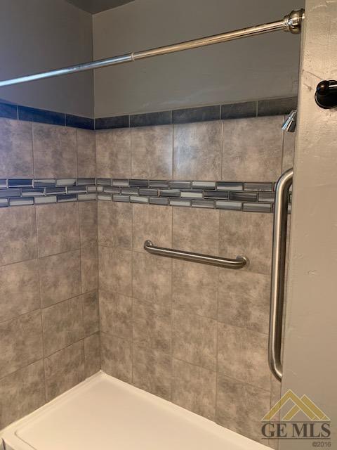 Undisclosed Address Bakersfield, CA 93304 - Photo 10 of 32 a bathroom with a shower