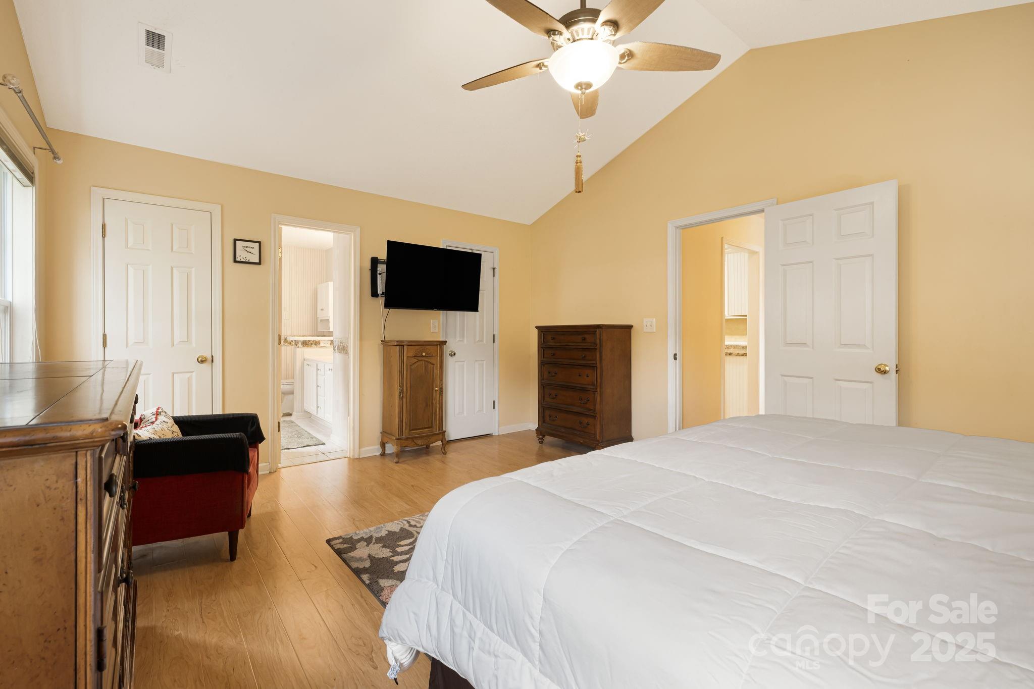 107 South Sunberry Trail Fletcher, NC 28732 - Photo 18 of 30 a bedroom with a bed and a flat screen tv